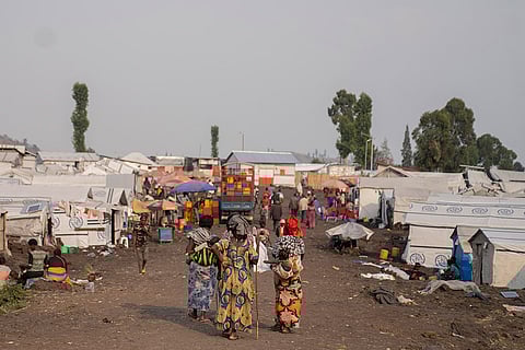 Congo Mpox: Women walk in the Bulengo refugee camp in Goma